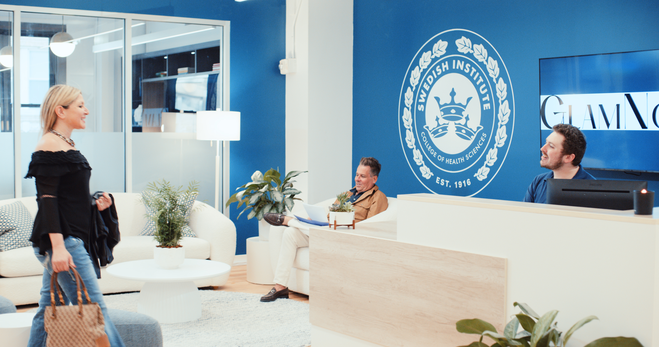 The Swedish Institute lobby with the College of Health Sciences seal on the navy wall
